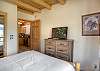 Queen bed on main floor with private deck.