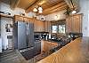 Cozy kitchen with granite countertops and stainless steel appliances.
