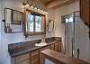 Main level bathroom with walk in shower.  Washer and dryer. 