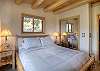 Queen bed on main floor with private deck.