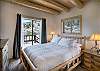 Queen bed on main floor with private deck.