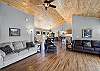 Our living room is large and open.  There are French Doors that lead out to the deck with mountain views, a gas fireplace and Smart TV.  Opening up to the dining area and kitchen. 