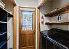 The laundry room has a washer & dryer and leads to the back deck.