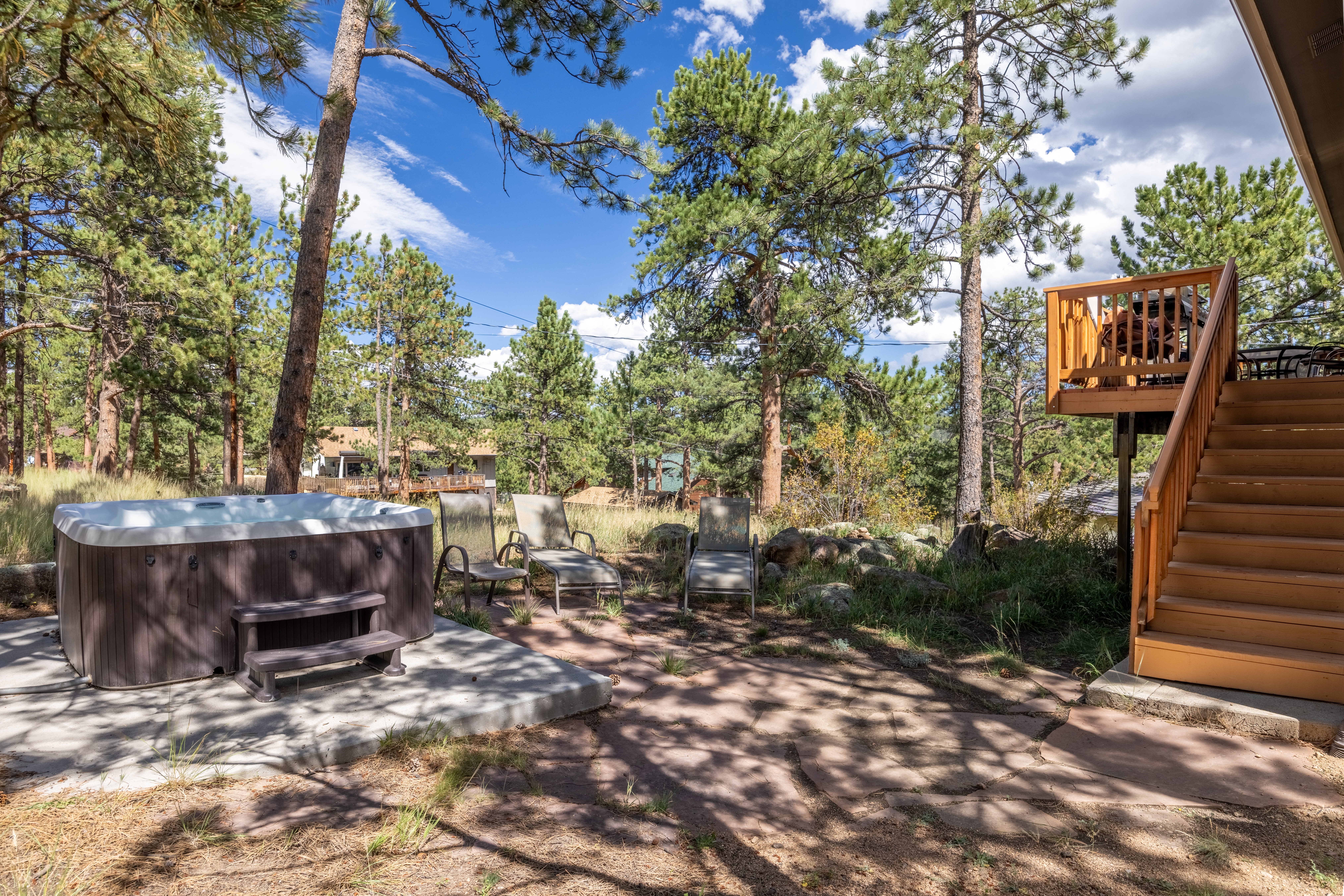 Behind the house, find the private hot tub and lounge seating. 