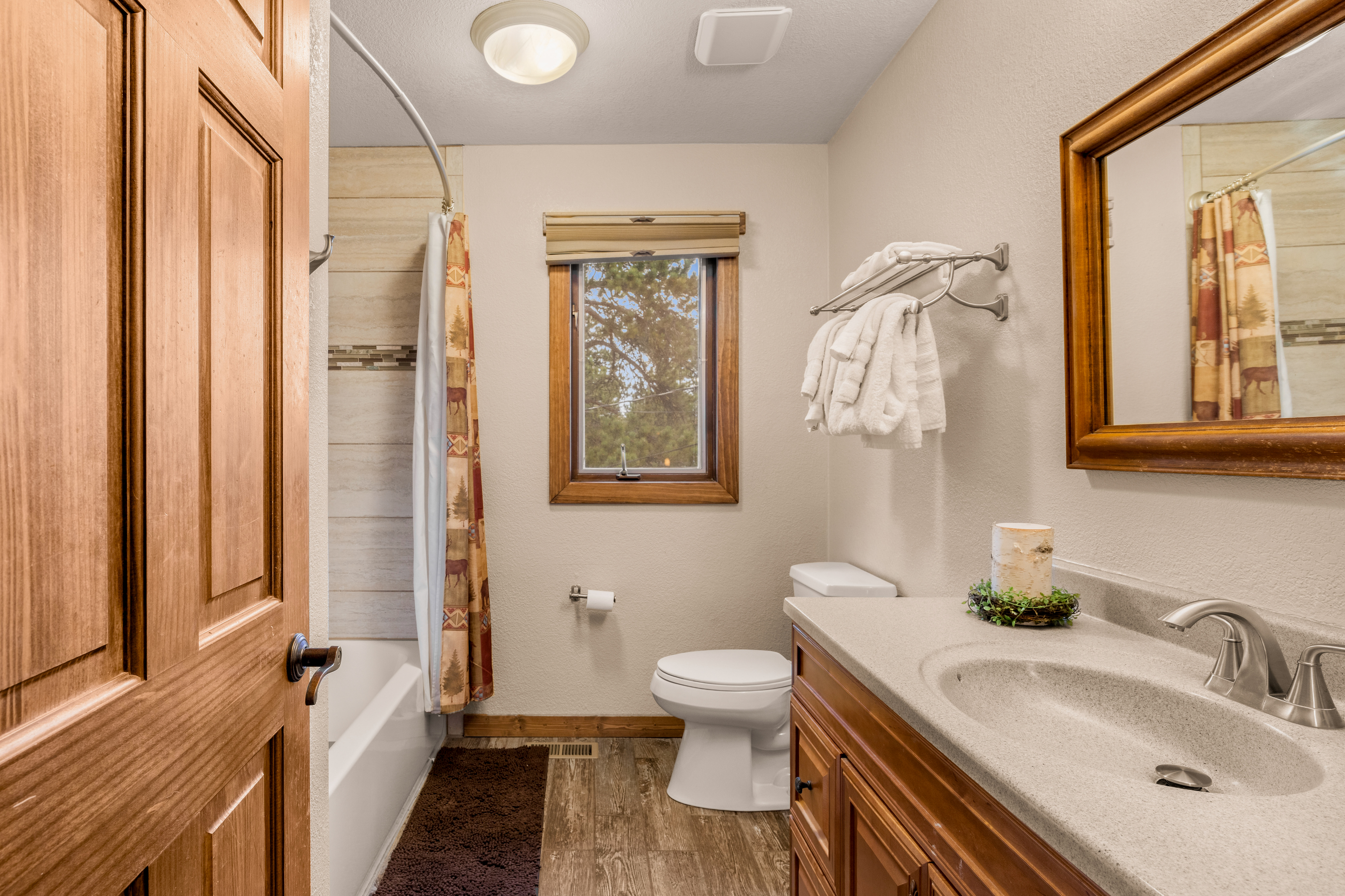 Guest bathroom with tub/shower combo.