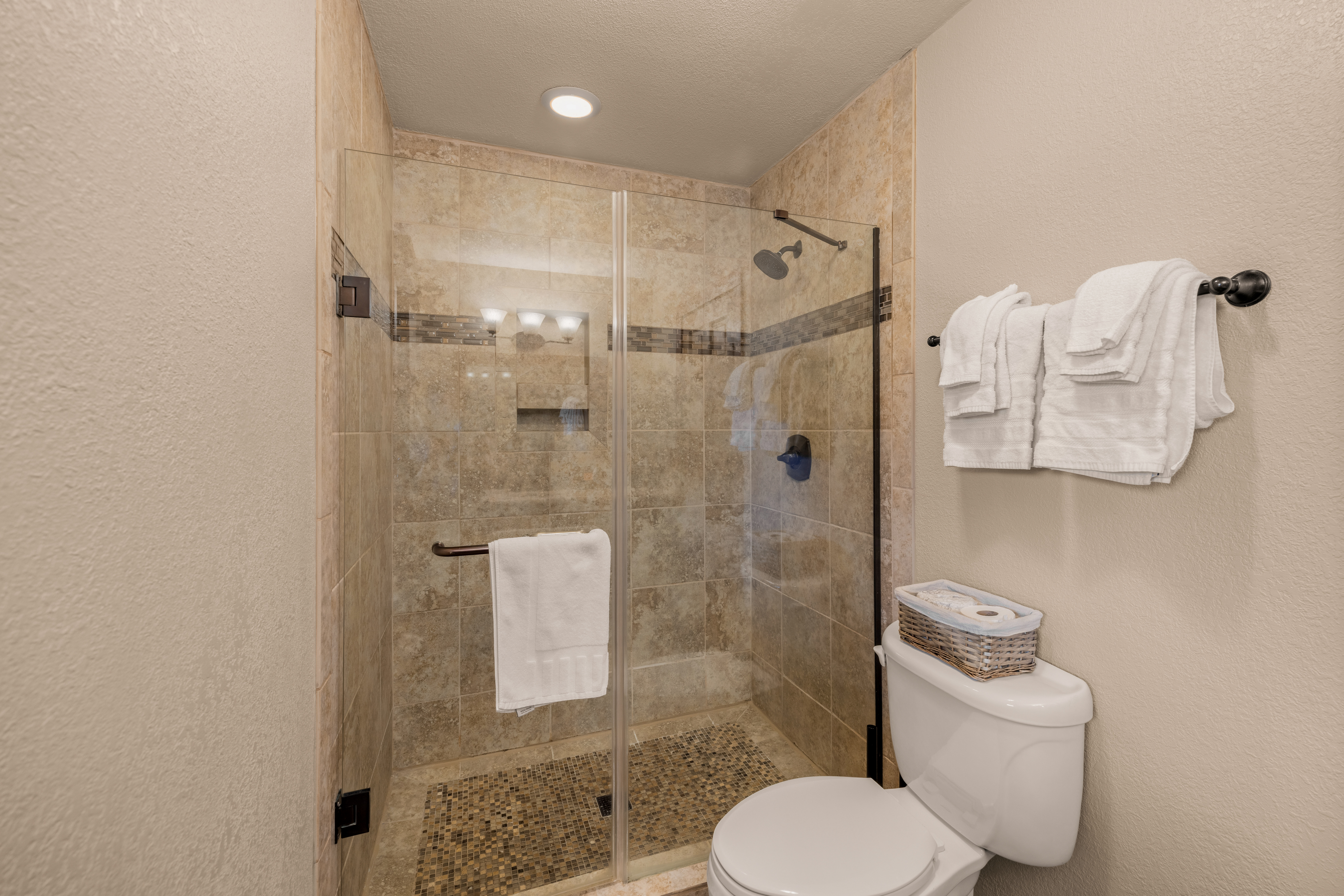 Primary en suite bathroom with walk-in shower.