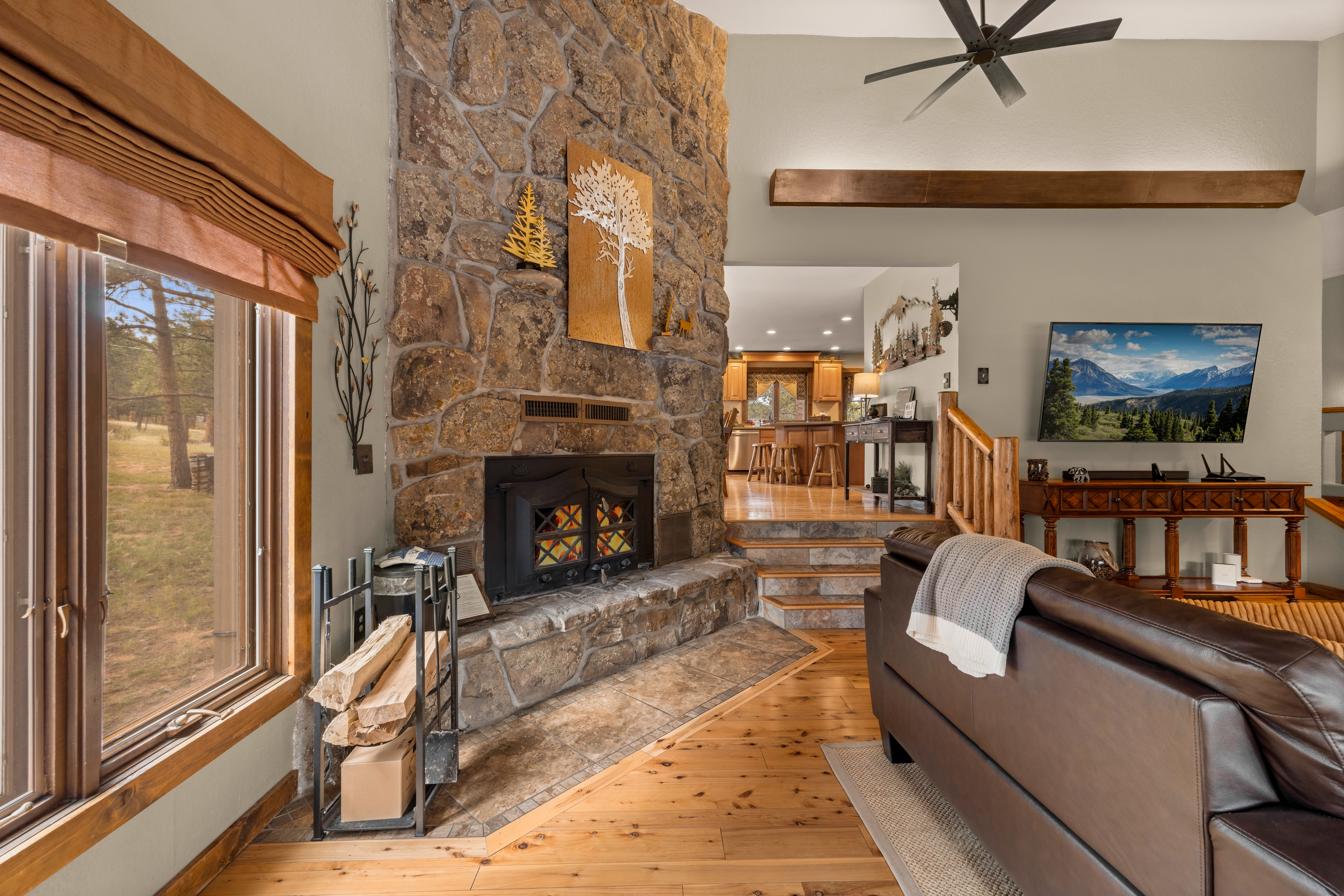 Keep warm after a day of mountain adventures with the wood burning fireplace.