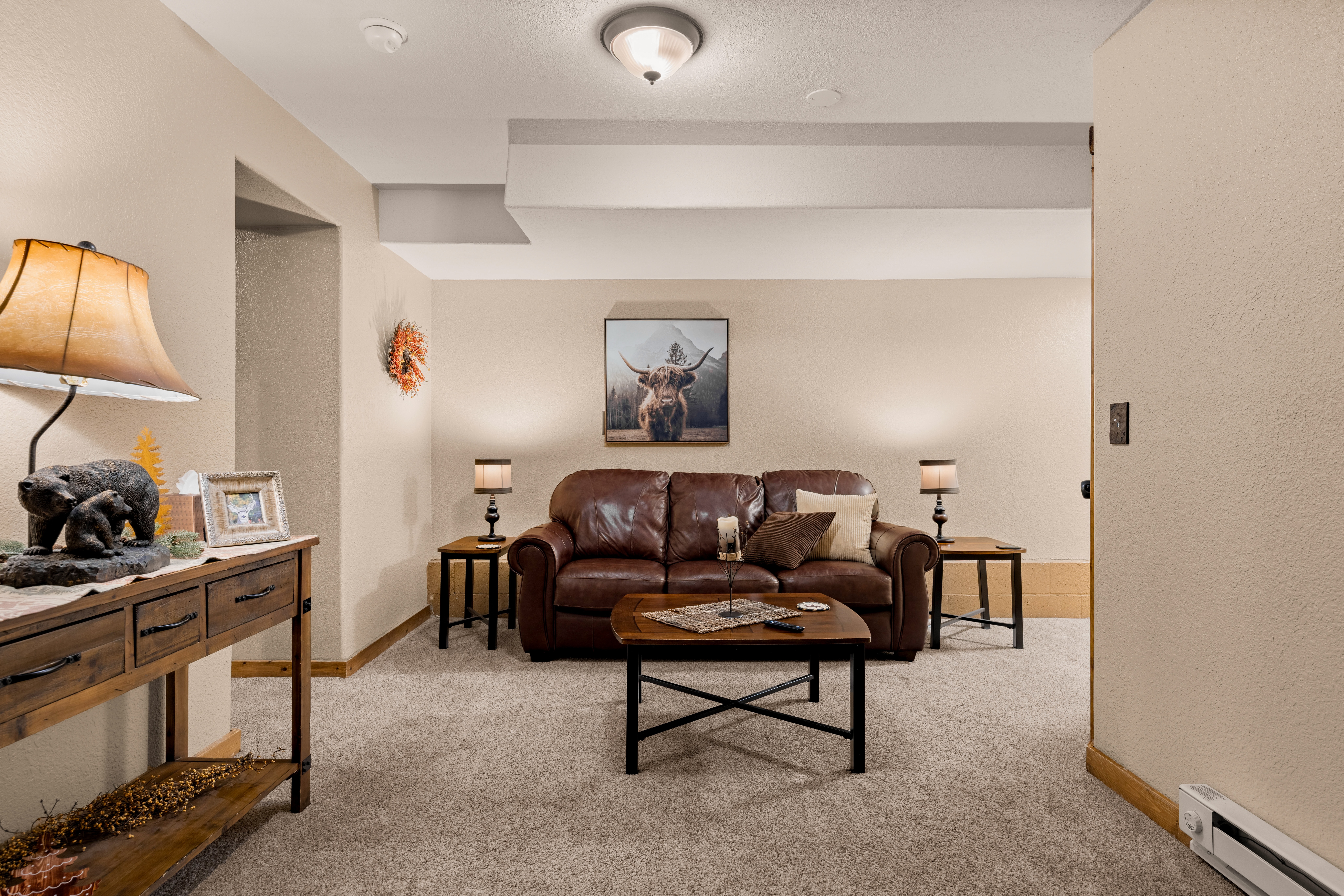 Lower level family room with a smart TV.
