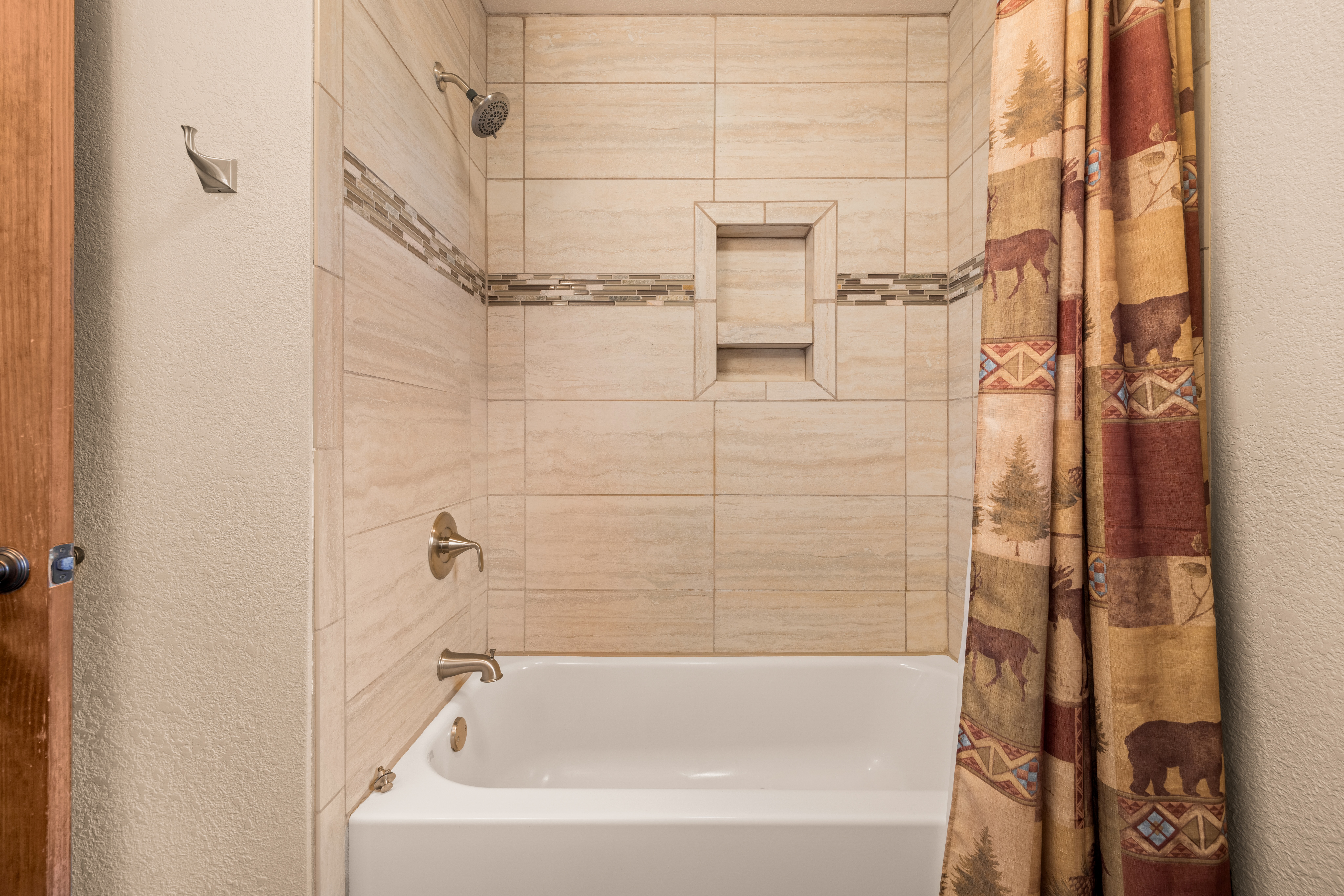 Guest bathroom with tub/shower combo.