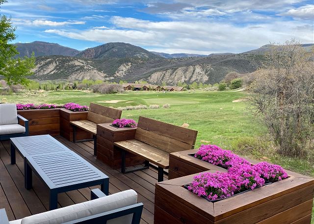 Spacious deck with plenty of seating, and sweeping views of the mountains