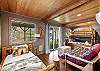This bedroom features two twin beds and a full size bed