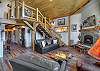 Gather, relax, and stay warm in this beautiful living room with a fireplace