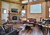 Living room with wood-burning fireplace and Smart TV
