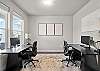 Office area with two workspaces complete with monitors and docking stations.