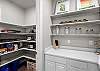 Pantry area complete with a large number of kitchen accessories you might need to cook for gatherings. 