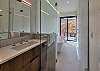 Master bathroom soaking tub/wet room opens to private patio for an outdoor shower experience