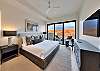 2nd master suite (upstairs) with balcony looking out at the La Sal Mountains and Moab's iconic red rock cliffs