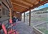 Enjoy the covered porch while taking in the mountain views