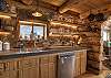 Open kitchen with stainless steel appliances