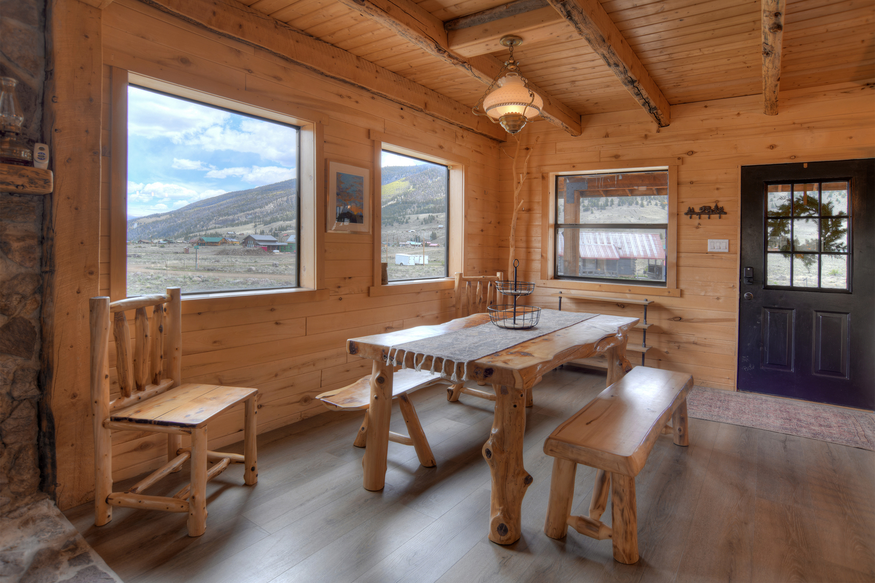 Open-concept first floor with large dining table. 