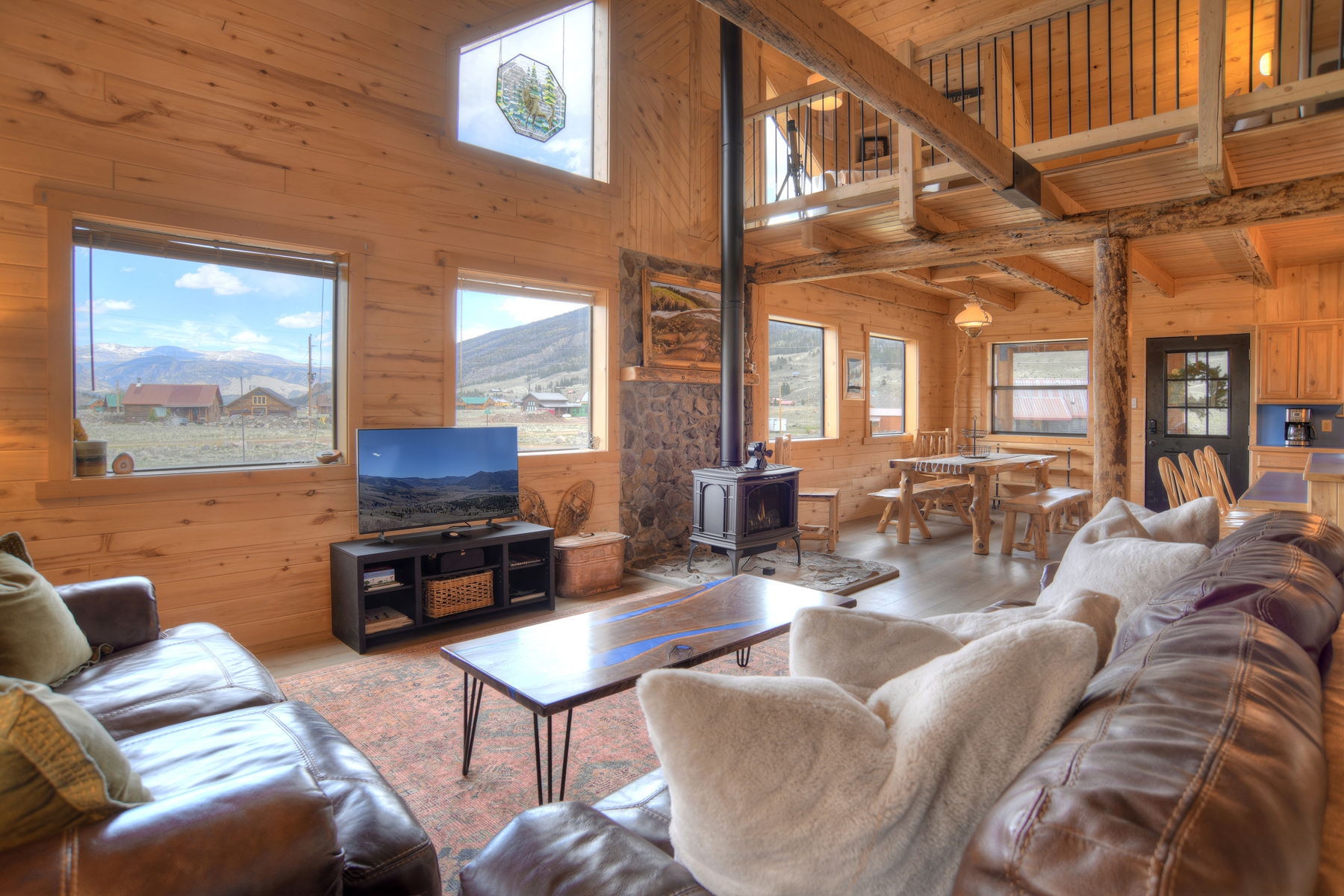 Open living, dining and kitchen with loft. 