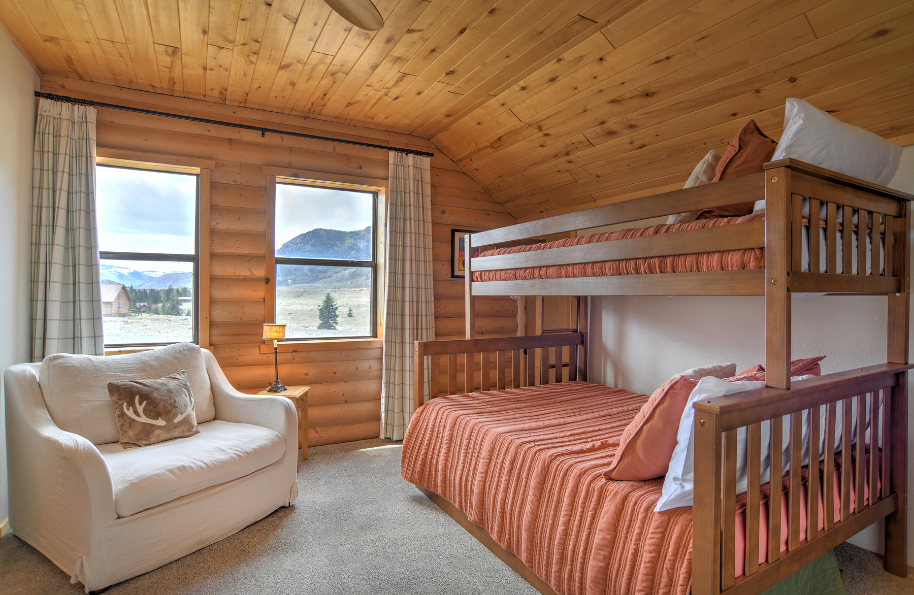Third bedroom on the second level featuring a twin-over-full bunk bed with a shared ensuite bathroom.