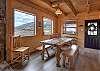 Open-concept first floor with large dining table. 