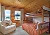 Third bedroom on the second level featuring a twin-over-full bunk bed with a shared ensuite bathroom.