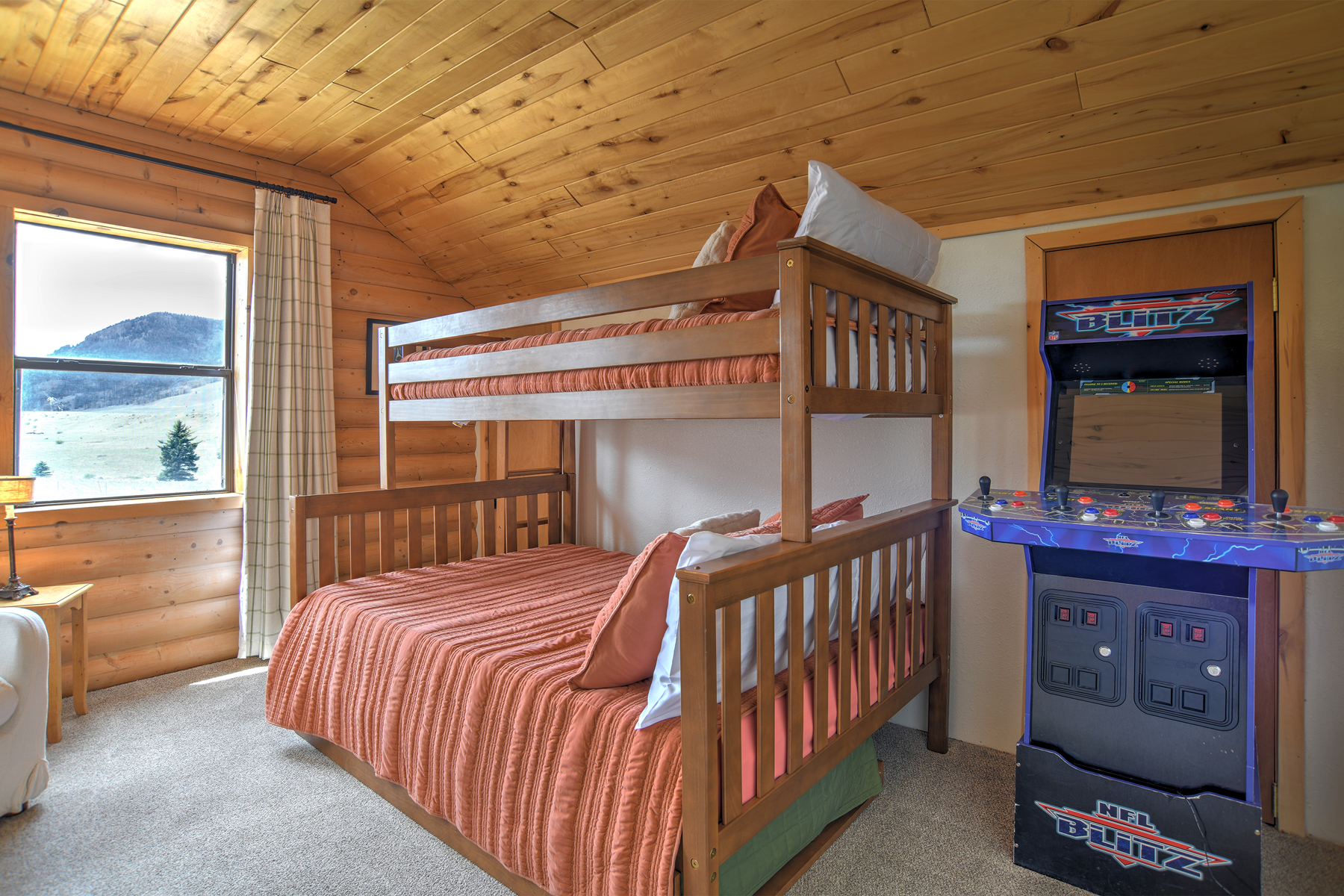 Bunk room equipped with video game.