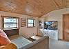 Upstairs loft with daybed and twin nook equipped with Smart TV.