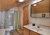 Upstairs shared ensuite bathroom with shower/tub combo. 