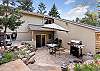 Private patio with seating, BBQ grill, and hot tub
