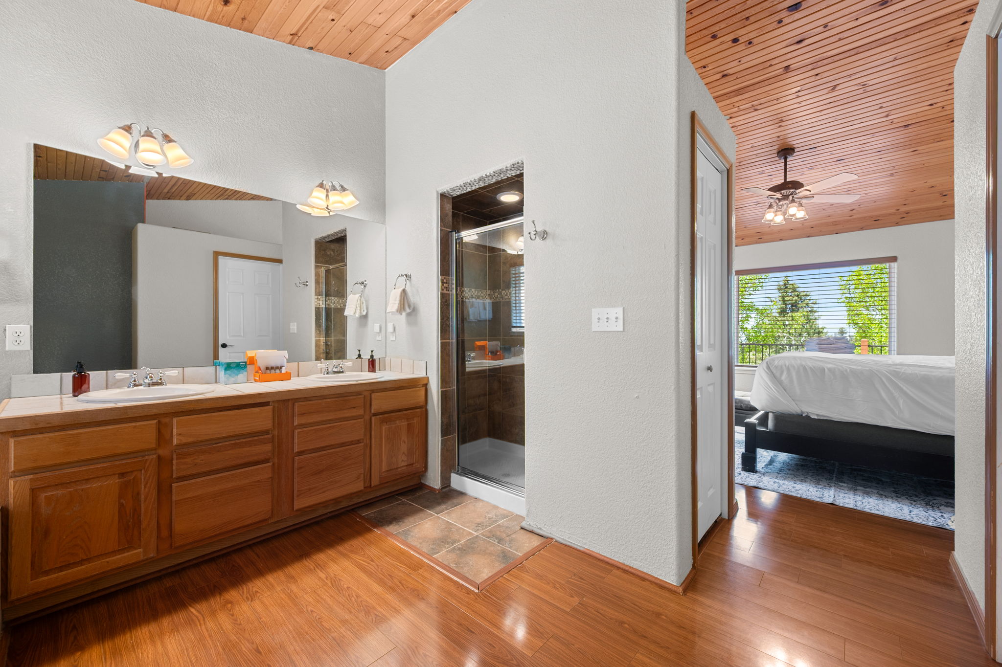Dual vanities, a soaking tub, and a walk in shower
