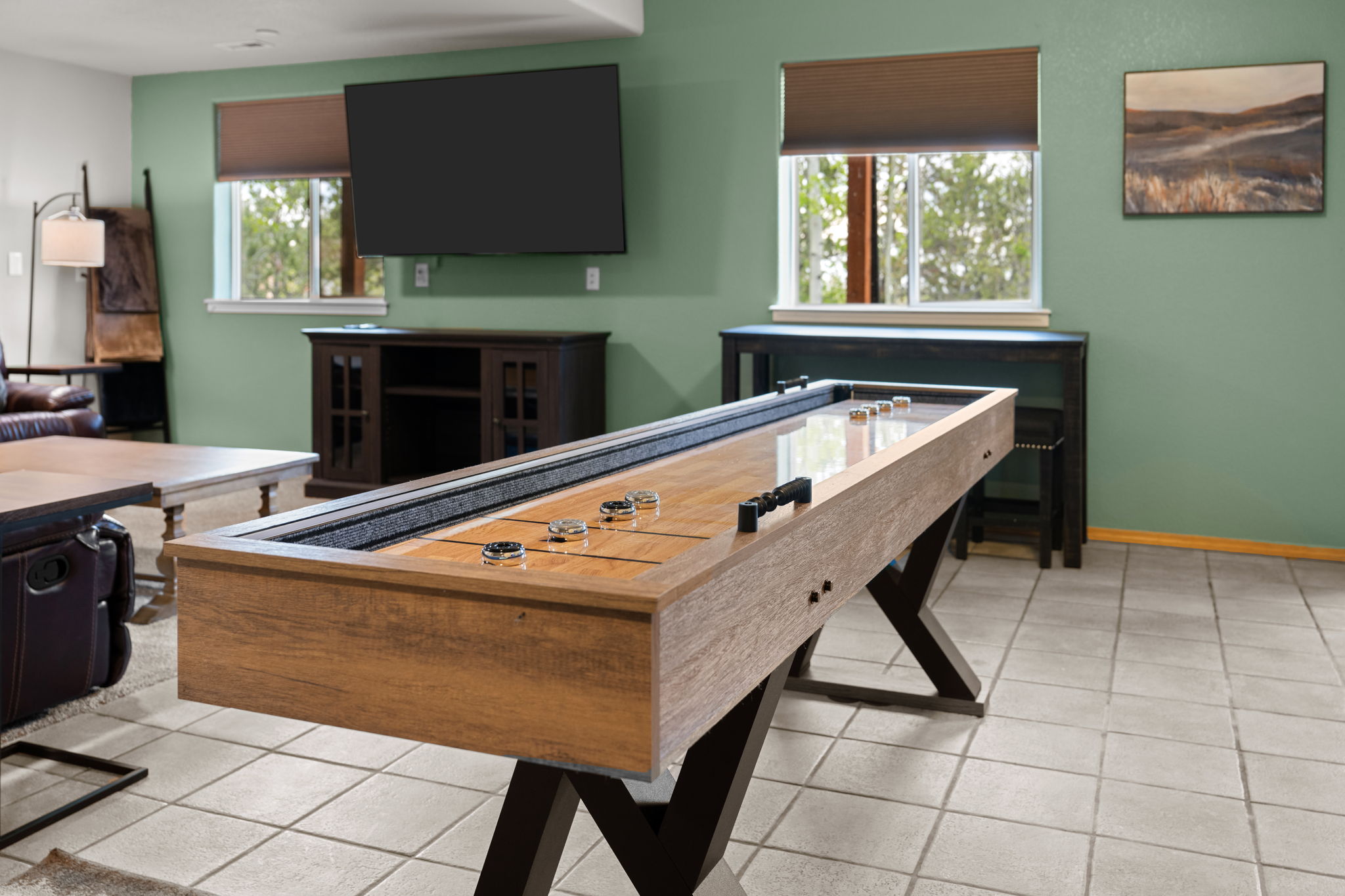 Let the fun begin! Enjoy shuffleboard, arcade games, comfy seating, and a Smart TV.