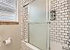 Full bathroom featuring a tub/shower combo 