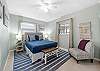 Bright and clean queen bedroom, perfect for a comfortable stay.
