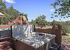 Unwind in the hot tub as the sun sets over the Santa Fe landscape.

