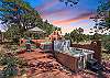 Unwind in the hot tub as the sun sets over the Santa Fe landscape.