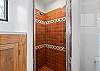 Fresh and functional full bathroom with a walk-in shower and contemporary design.
