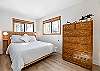 Relax and recharge in this cozy queen bedroom retreat.
