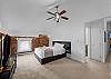 Bright and clean queen bedroom, perfect for a comfortable stay.
