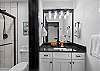 Full bathroom featuring a sleek walk-in shower.
