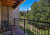 Spacious back deck with wooded views