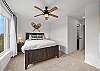 Bright and clean queen bedroom, perfect for a comfortable stay.
