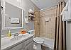 Full bathroom featuring a sleek walk-in shower.
