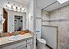 Full bathroom featuring a sleek walk-in shower.
