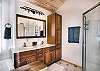 Full bathroom with dual vanities 