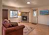 Lower level living room with Queen sleeper sofa and its own fireplace