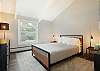 Well-appointed queen bedroom designed for a restful night’s sleep.
