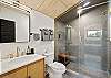 Fresh and functional full bathroom with a walk-in shower and contemporary design.
